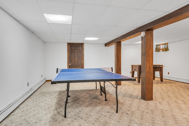 rec room featuring carpet, a drop ceiling, and baseboard heating