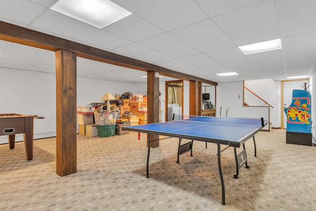 playroom with washer / dryer, carpet floors, and a drop ceiling