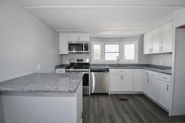 kitchen featuring white cabinetry, sink, stainless steel appliances, and stone countertops