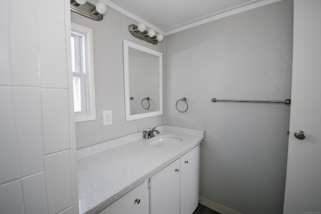 bathroom with vanity and ornamental molding