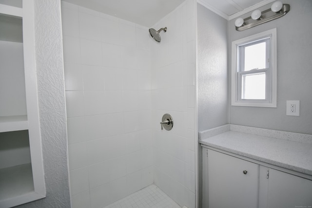 bathroom with tiled shower