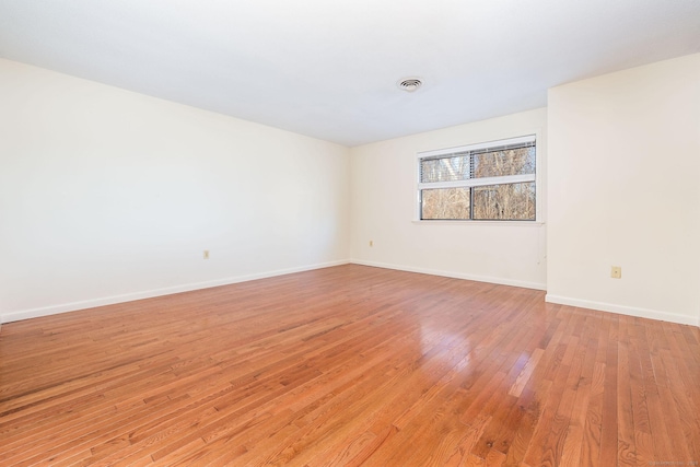 empty room with light wood-type flooring