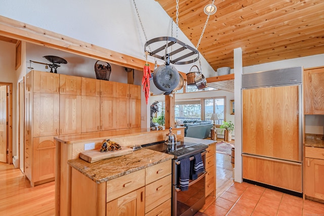 kitchen featuring wooden ceiling, light stone countertops, light brown cabinetry, stainless steel range with electric stovetop, and paneled fridge