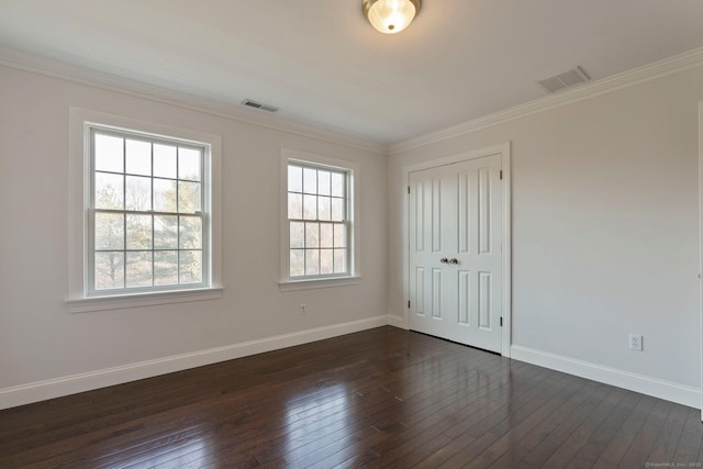 unfurnished bedroom featuring visible vents, baseboards, and dark wood finished floors