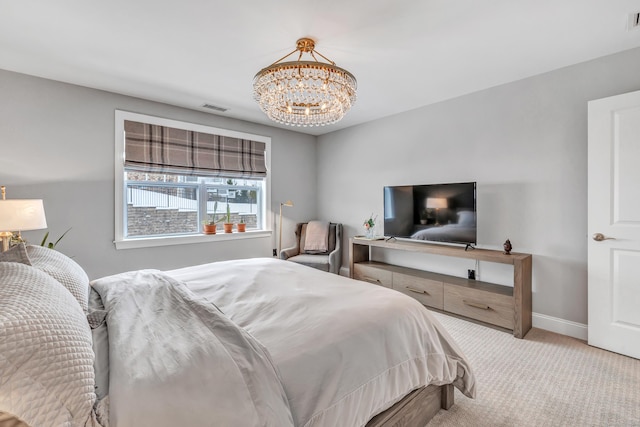 bedroom featuring baseboards, visible vents, a notable chandelier, and light colored carpet