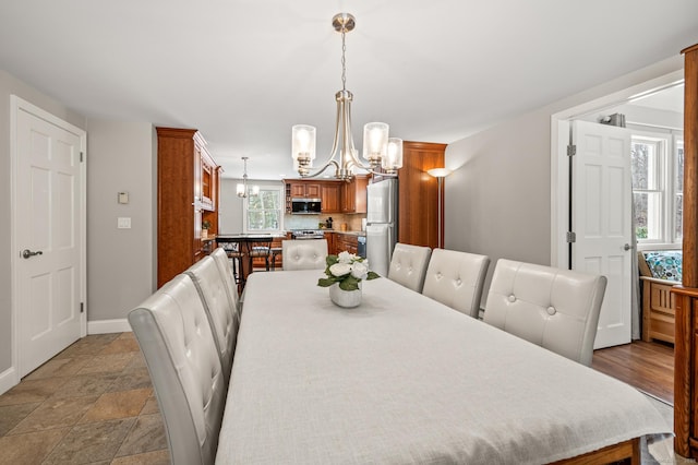 dining area with an inviting chandelier