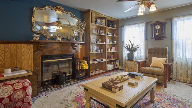 49 Quinebaug Ave, Putnam, CT 06260 - sitting room featuring ceiling fan, a fireplace with flush hearth, and plenty of natural light
