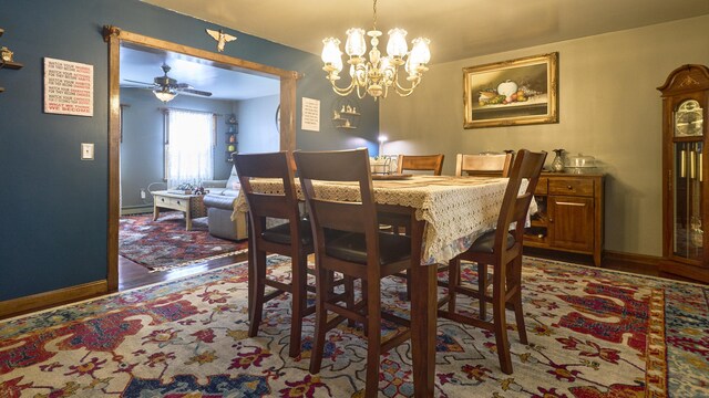 49 Quinebaug Ave, Putnam, CT 06260 - dining room featuring ceiling fan, baseboards, a chandelier, and wood finished floors