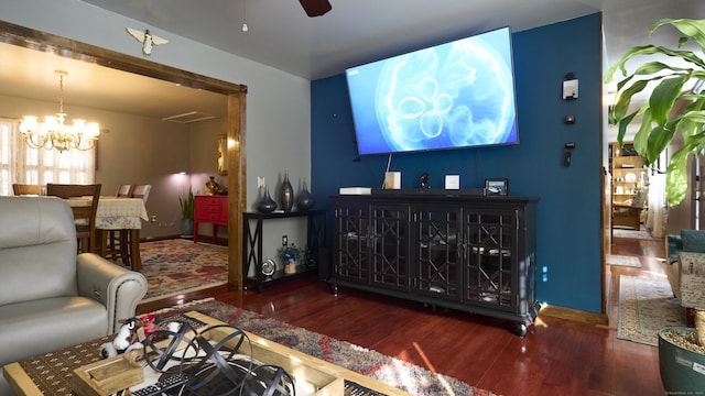 49 Quinebaug Ave, Putnam, CT 06260 - living room featuring wood finished floors, a chandelier, ceiling fan, and baseboards
