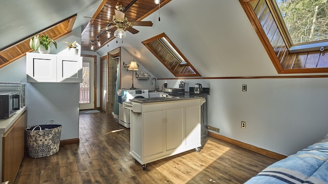 49 Quinebaug Ave, Putnam, CT 06260 - kitchen featuring baseboards, ceiling fan, a skylight, and dark wood finished floors