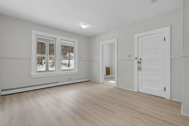 foyer featuring light hardwood / wood-style flooring and baseboard heating