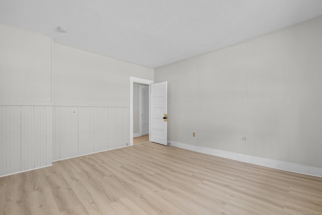 empty room with light hardwood / wood-style floors