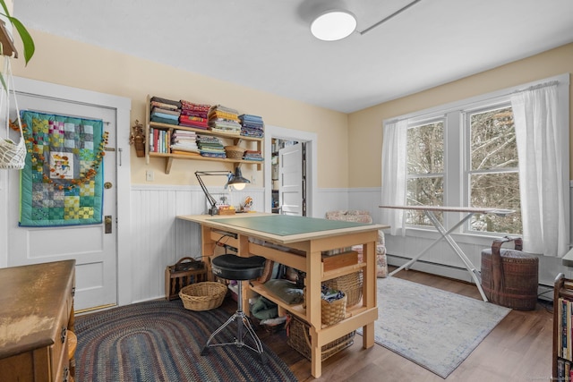 office area featuring hardwood / wood-style flooring and baseboard heating