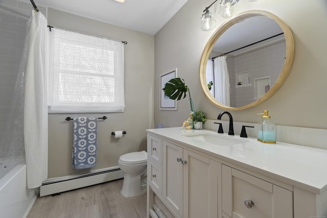 bathroom featuring a baseboard radiator, toilet, shower / bath combo with shower curtain, vanity, and wood finished floors