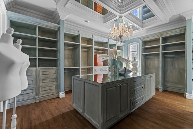 spacious closet featuring coffered ceiling, dark wood finished floors, beamed ceiling, and an inviting chandelier