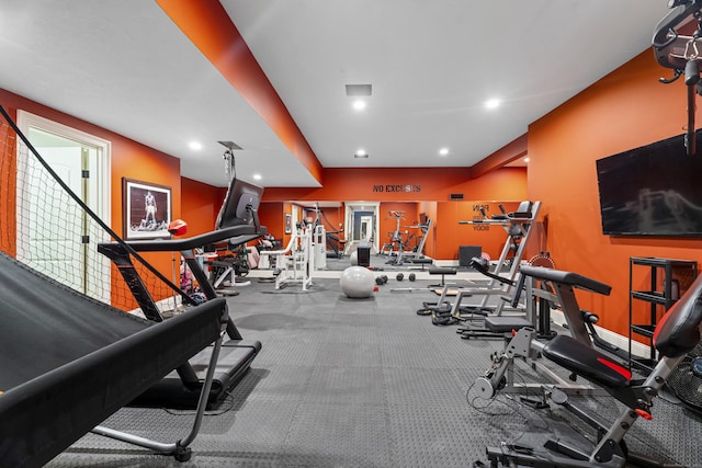 exercise room featuring recessed lighting and baseboards