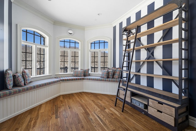 unfurnished room featuring ornamental molding and wood finished floors