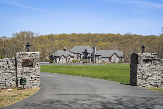 131 Burr Hill Rd, Killingworth, CT 06419 - view of home's community featuring aphalt driveway, a yard, and a wooded view