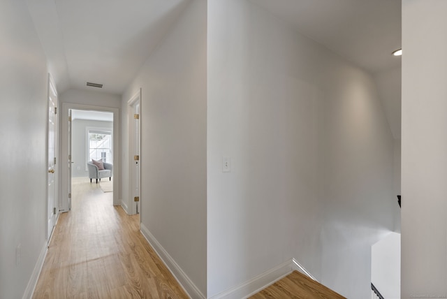 hall with light hardwood / wood-style flooring