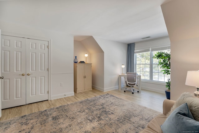 office area with light hardwood / wood-style floors