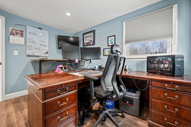 home office featuring baseboards and wood finished floors