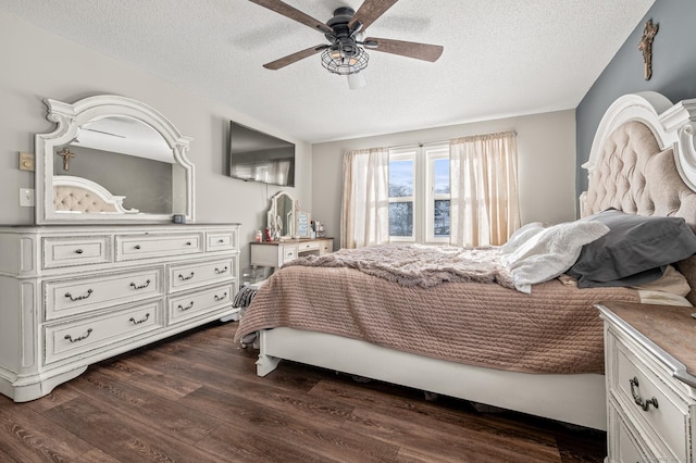 bedroom with a ceiling fan, dark wood-style flooring, and a textured ceiling