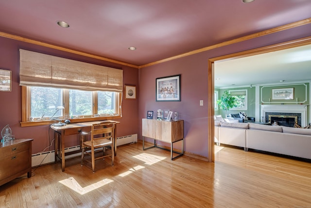 home office with light wood-type flooring, a fireplace, baseboards, and crown molding