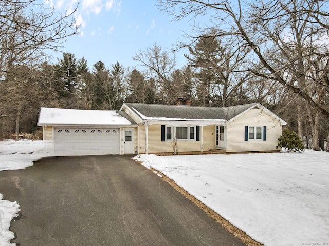 single story home featuring a garage