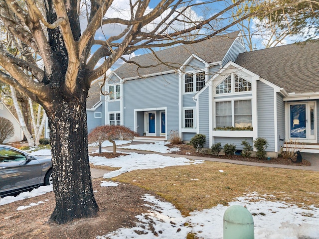 front of property with a lawn