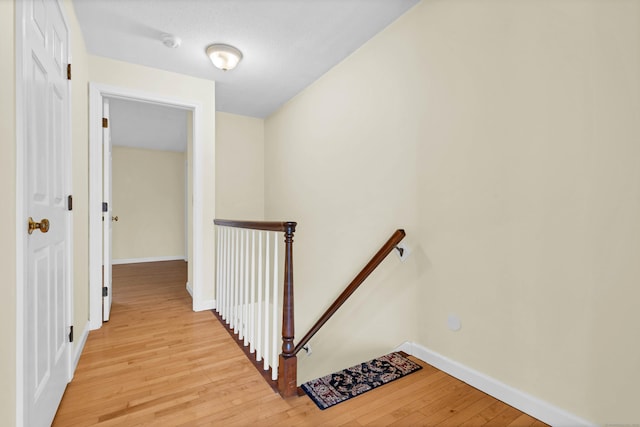 hallway with light hardwood / wood-style flooring