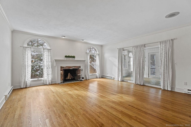 unfurnished living room featuring a brick fireplace, a baseboard heating unit, wood finished floors, and ornamental molding