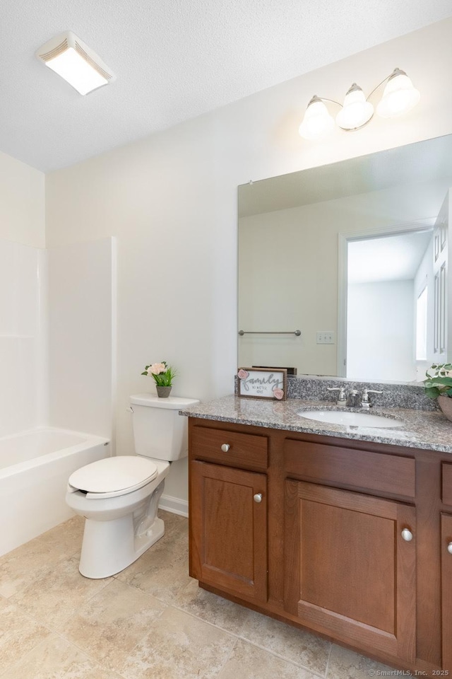 full bath with washtub / shower combination, vanity, toilet, and a textured ceiling