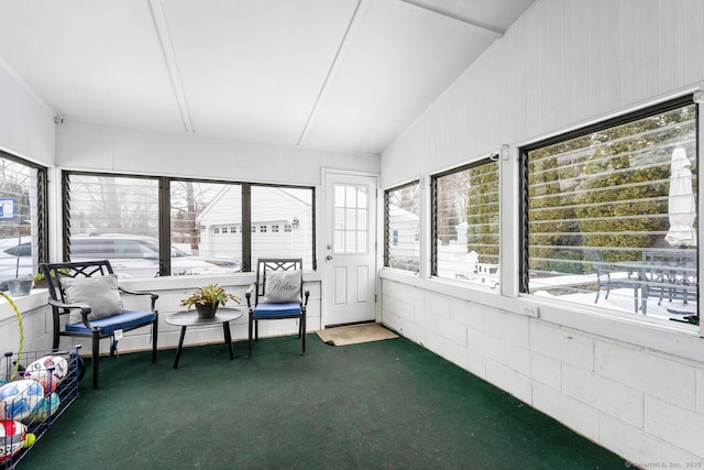 unfurnished sunroom with lofted ceiling