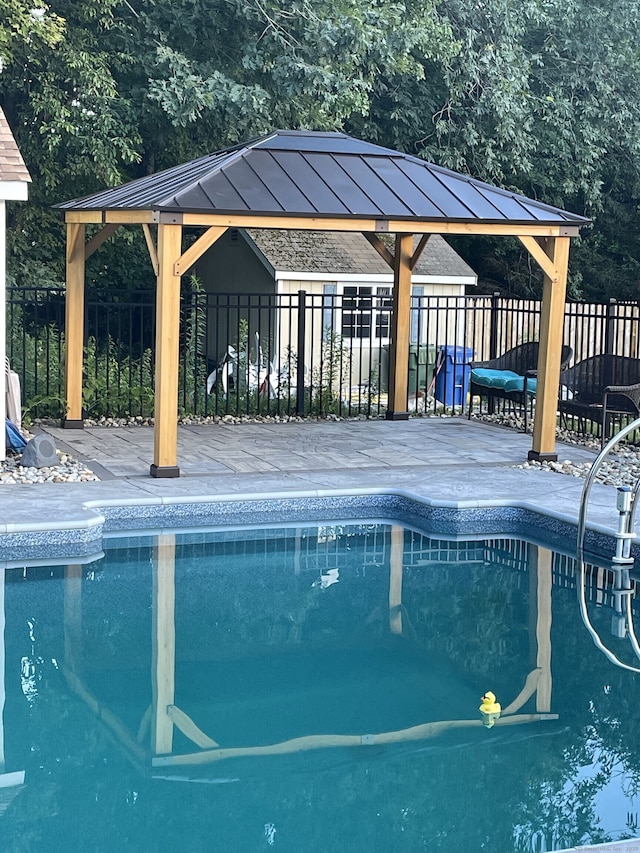 view of pool with a gazebo and a patio