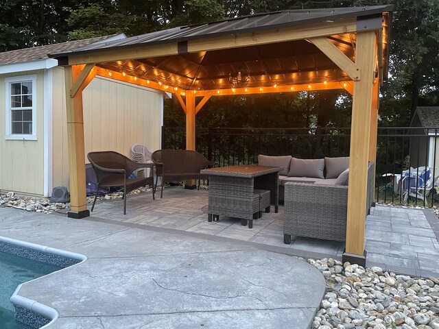 view of patio featuring an outdoor living space and a gazebo