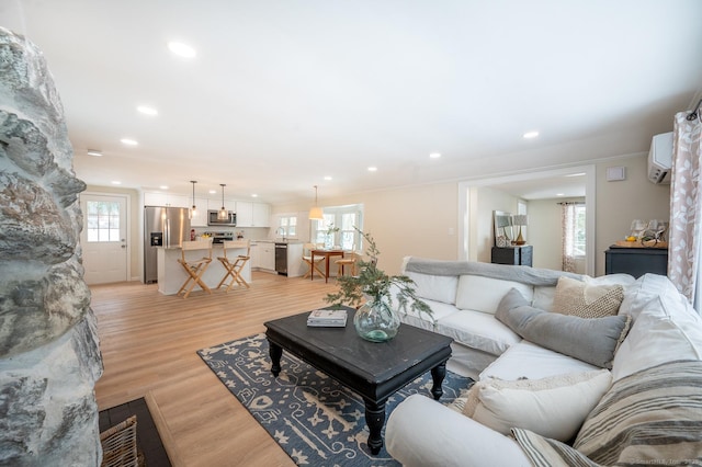 living room featuring recessed lighting and light wood-style floors