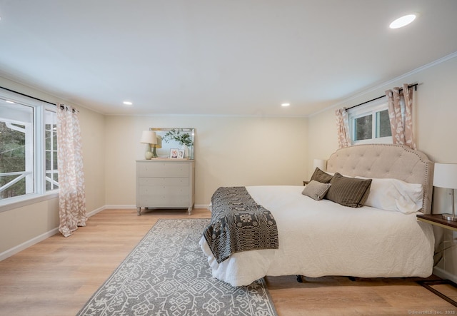 bedroom featuring recessed lighting, baseboards, wood finished floors, and ornamental molding