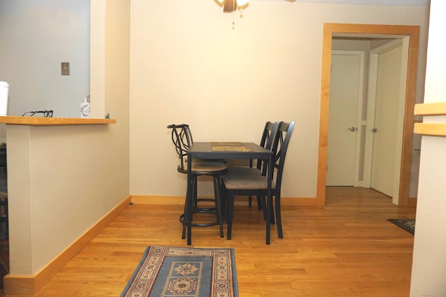 dining area with light hardwood / wood-style flooring