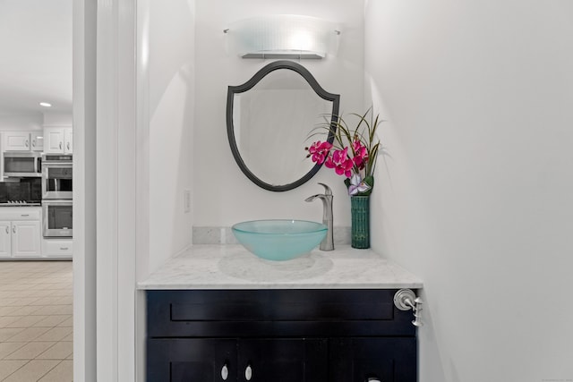 room details with stainless steel appliances and vanity