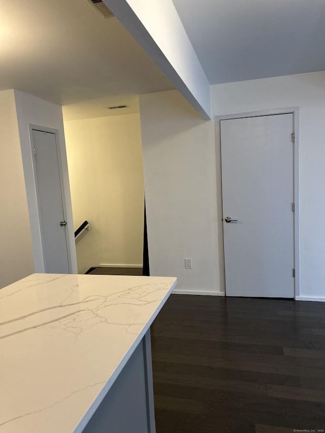 kitchen with dark hardwood / wood-style flooring