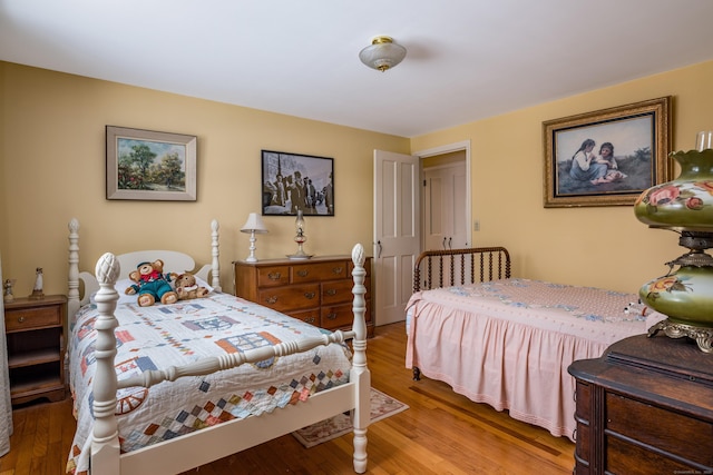 bedroom with wood finished floors