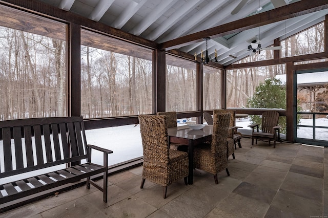 sunroom featuring vaulted ceiling with beams and ceiling fan