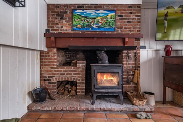 details featuring a wood stove and wooden walls