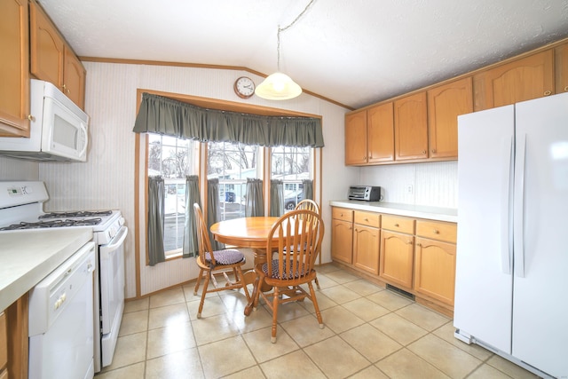 kitchen with white appliances, wallpapered walls, vaulted ceiling, and light countertops