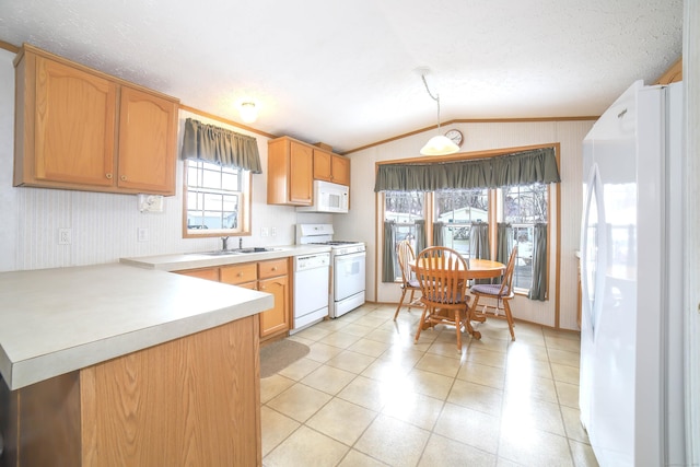 kitchen with lofted ceiling, light tile patterned flooring, a peninsula, white appliances, and light countertops