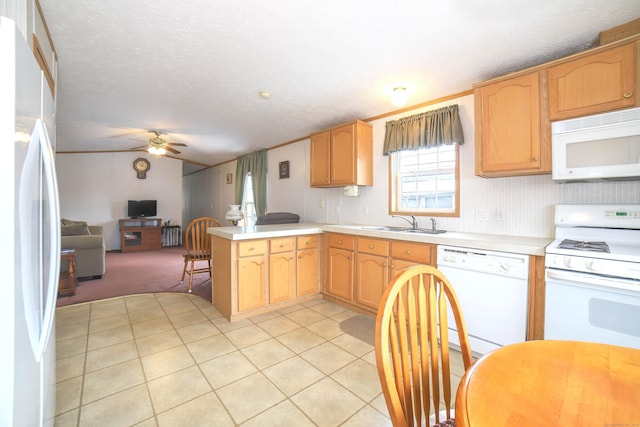 kitchen featuring ceiling fan, a peninsula, white appliances, open floor plan, and light countertops