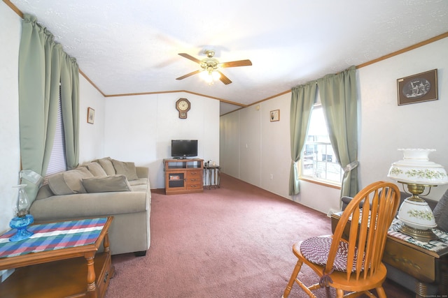 carpeted living area featuring ceiling fan, ornamental molding, and lofted ceiling