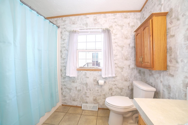 bathroom with toilet, tile patterned floors, visible vents, a shower with curtain, and wallpapered walls