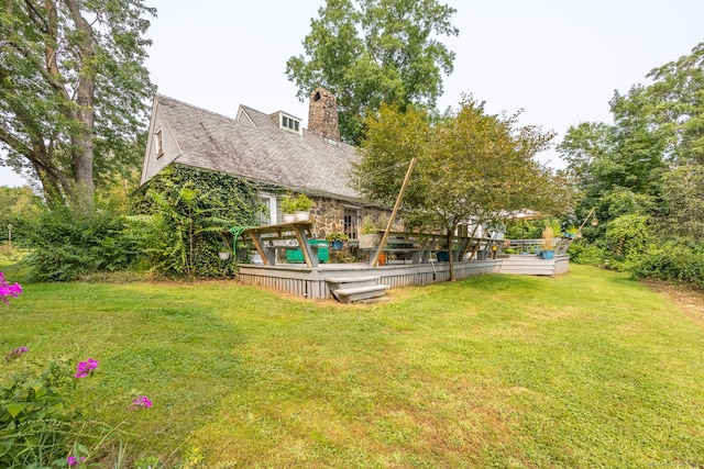 view of yard with a wooden deck