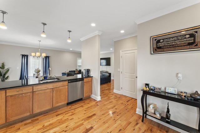 kitchen with stainless steel dishwasher, brown cabinetry, dark countertops, and a sink